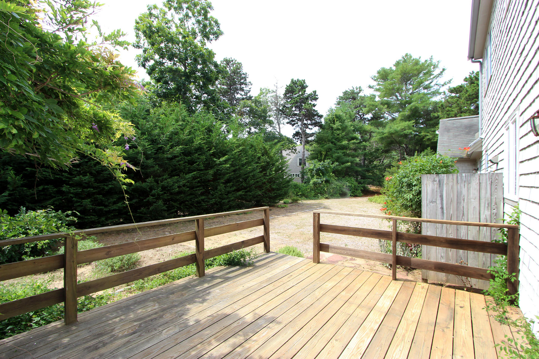216 Cathedral Road Brewster, MA 02631 - Photo 4 of 56 a view of outdoor space with deck and yard