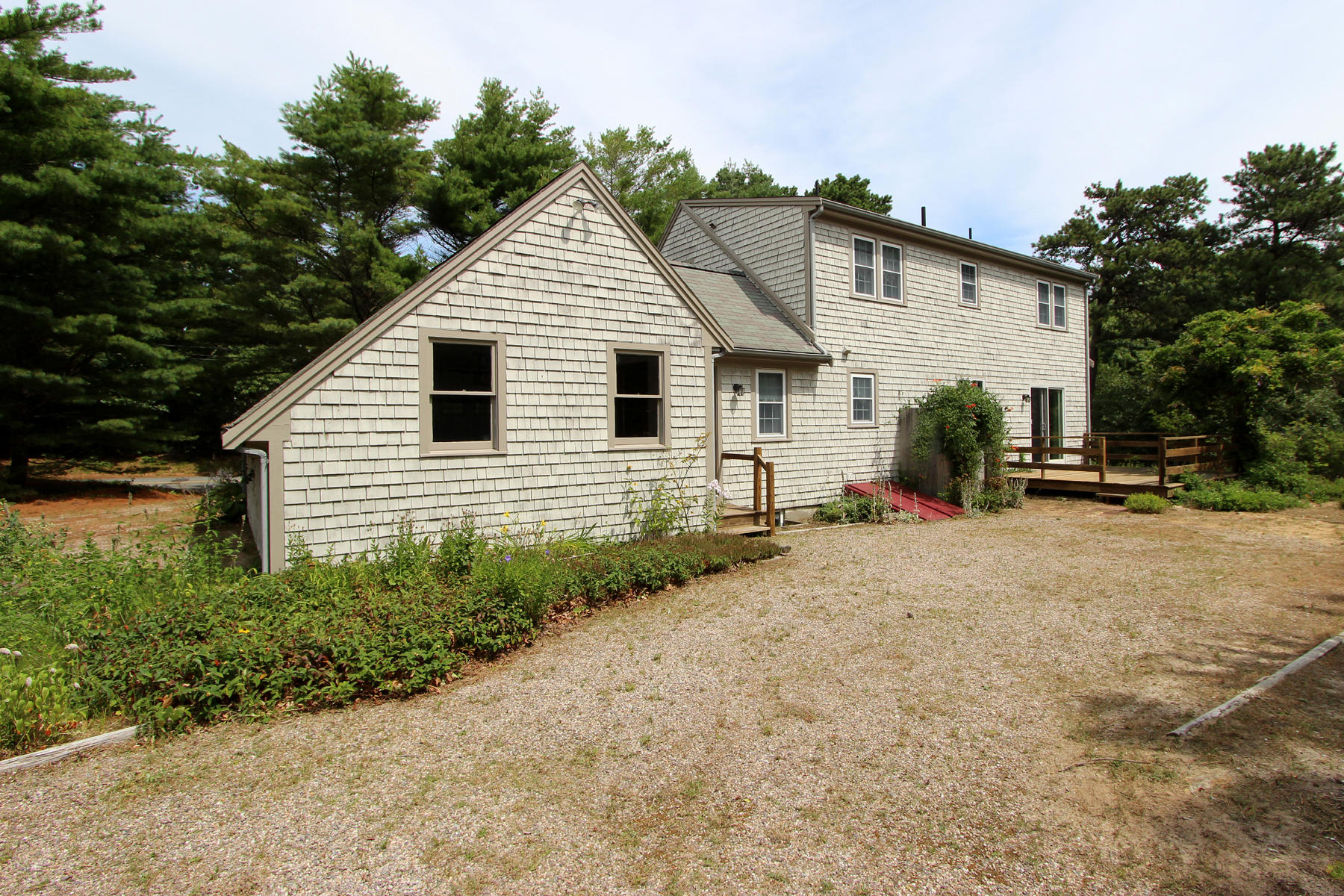 216 Cathedral Road Brewster, MA 02631 - Photo 6 of 56 a view of a house with backyard and trees