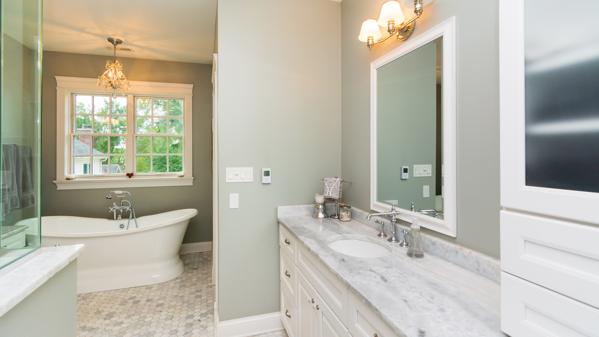 4800 Wolf Road Western Springs, IL 60558 - Photo 22 of 47 a bathroom with a granite countertop double vanity sink a mirror and a bathtub