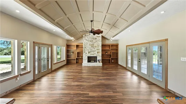 a view of a room with wooden floor