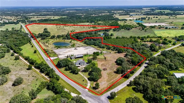 an aerial view of residential houses and outdoor space