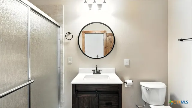a view of a livingroom with wooden floor and a window