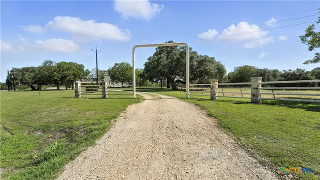 a view of a field with trees