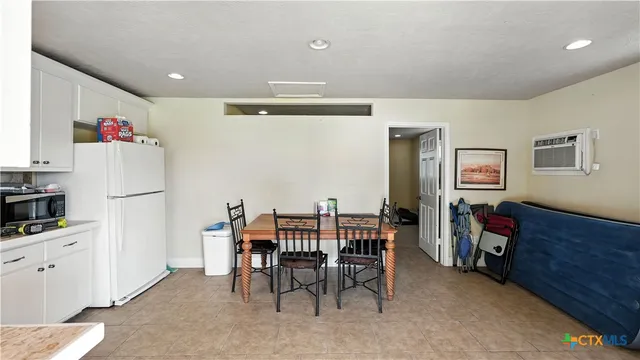 a view of a house with a yard and sitting area