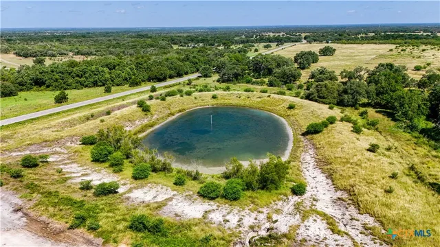 a view of a lake with houses in the background