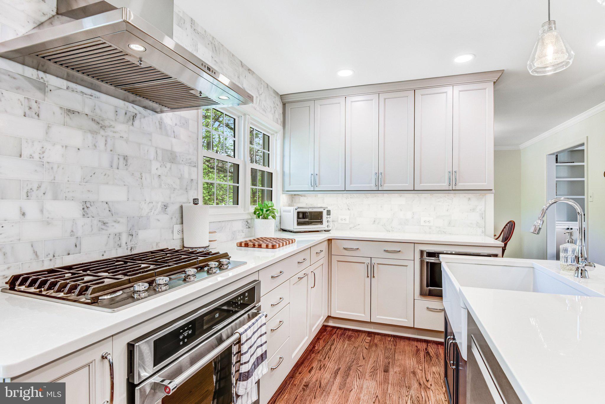 6600 Kensal Court Springfield, VA 22152 - Photo 21 of 43 a kitchen with a stove a sink a refrigerator and window