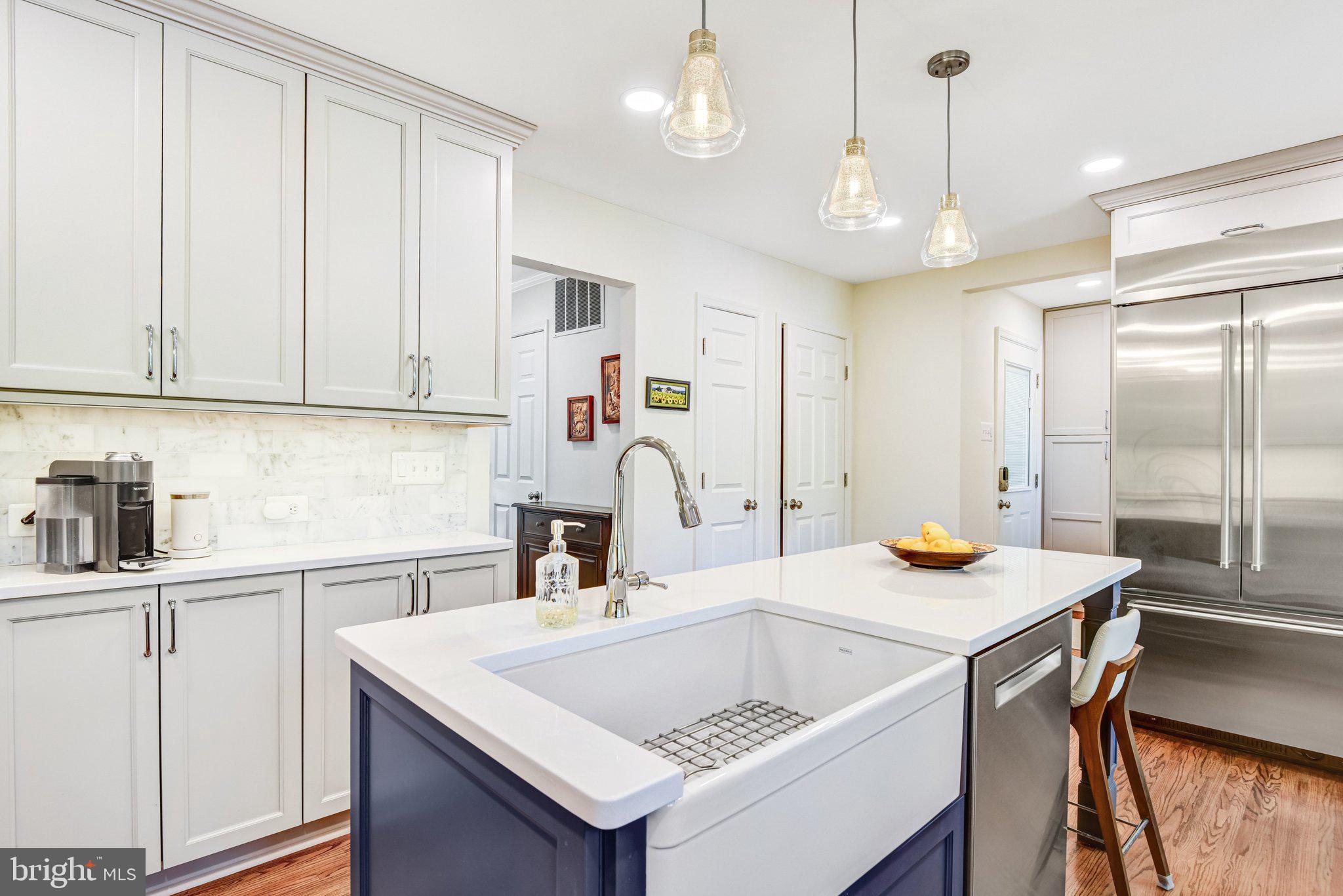 6600 Kensal Court Springfield, VA 22152 - Photo 22 of 43 a view of kitchen island a sink and living room