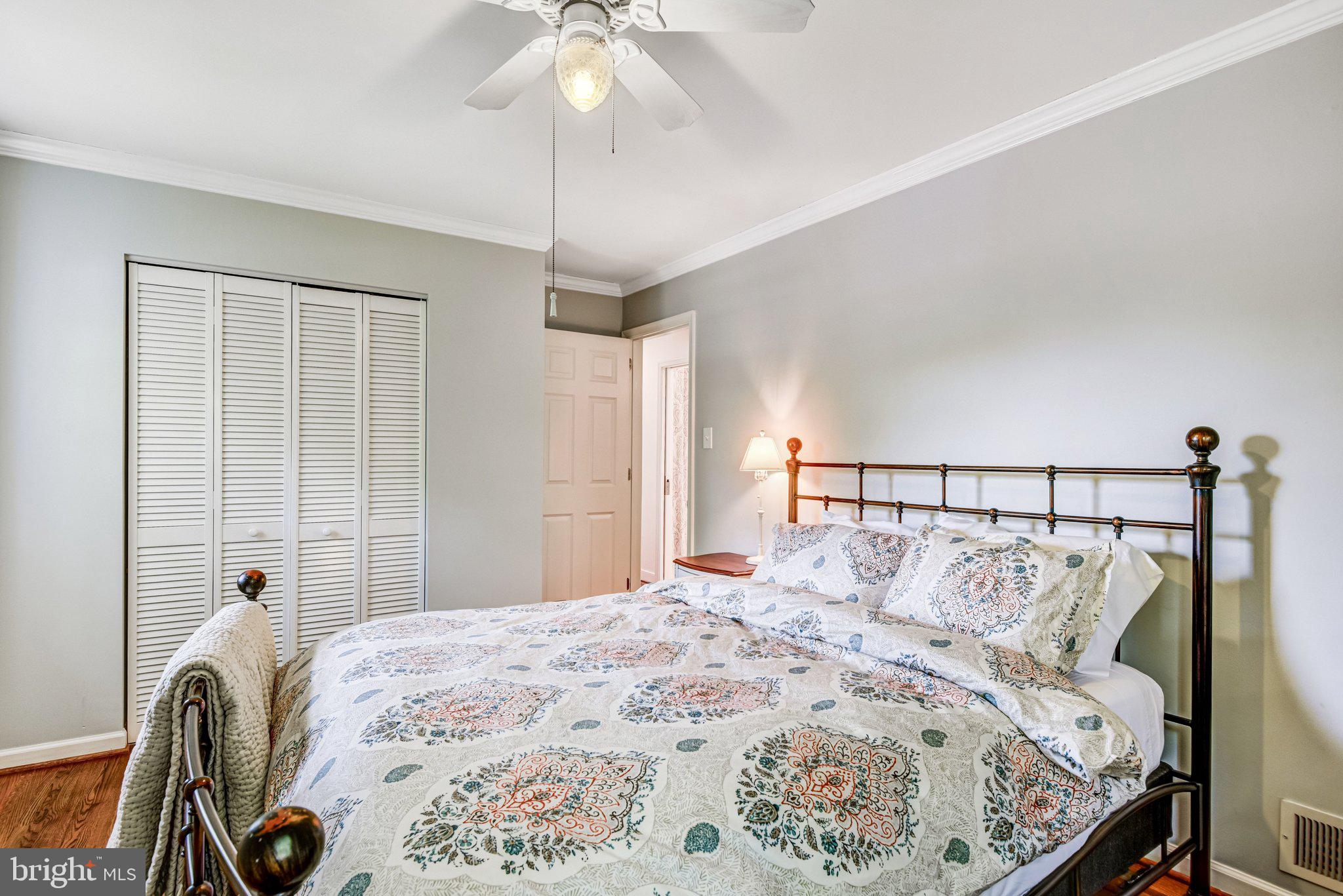 6600 Kensal Court Springfield, VA 22152 - Photo 29 of 43 a bedroom with a bed and a chandelier