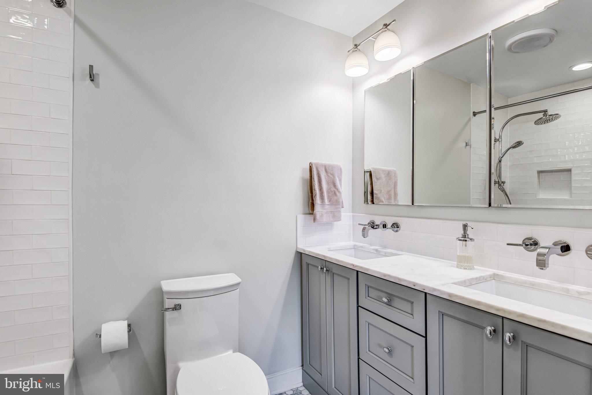 6600 Kensal Court Springfield, VA 22152 - Photo 34 of 43 a bathroom with a sink toilet and shower