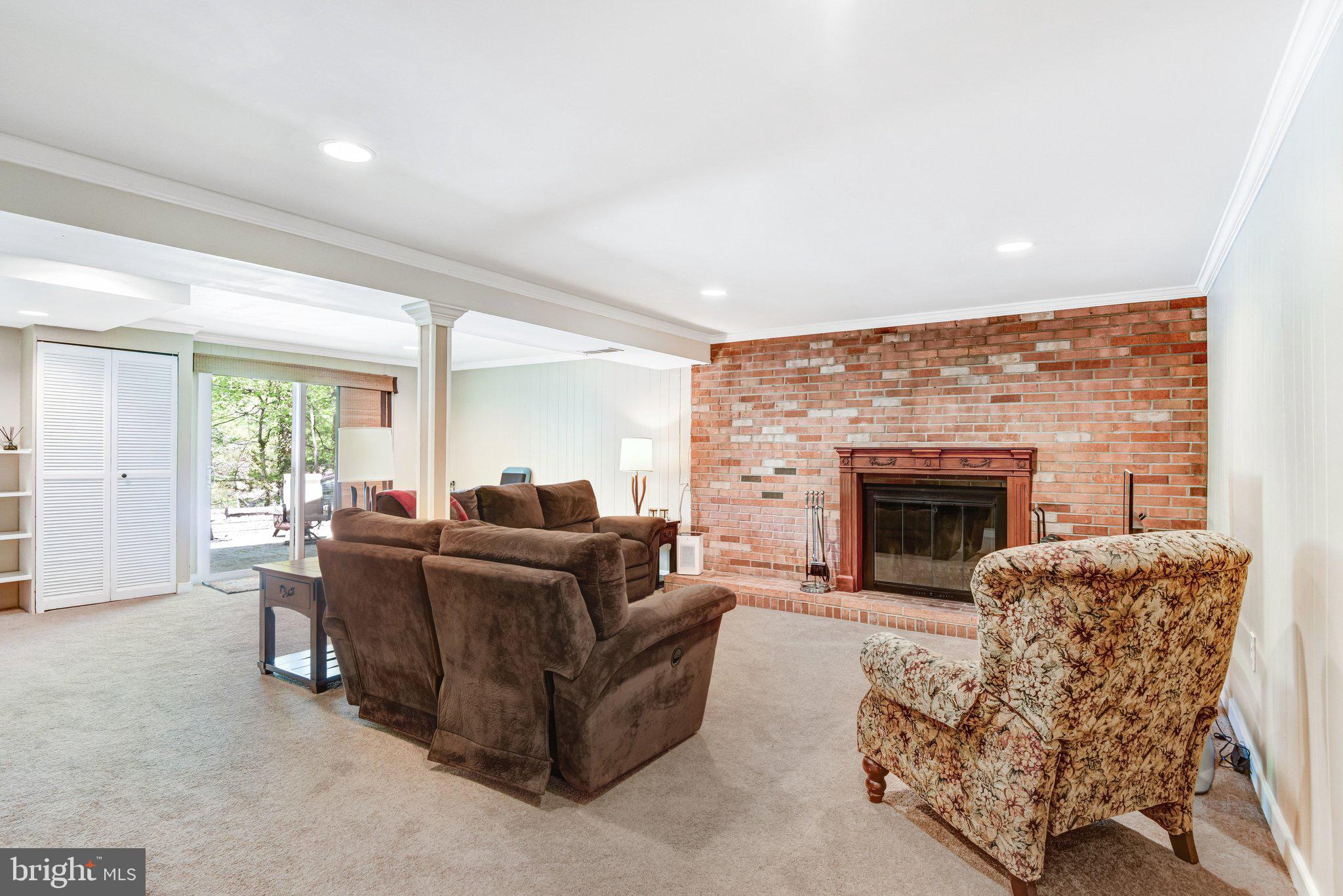 6600 Kensal Court Springfield, VA 22152 - Photo 35 of 43 a living room with furniture and a fireplace