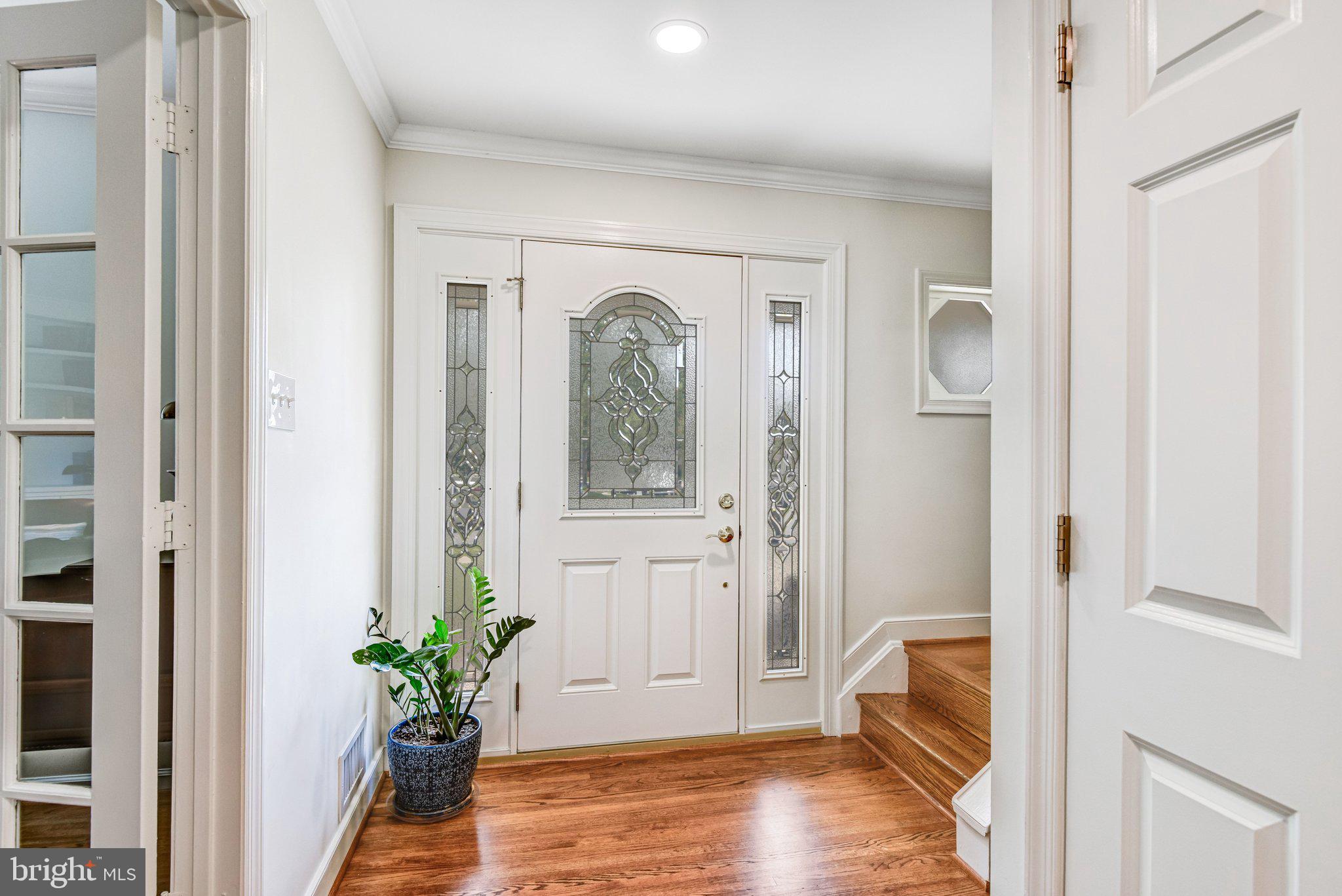 6600 Kensal Court Springfield, VA 22152 - Photo 5 of 43 a view of a hallway with wooden floor and front door