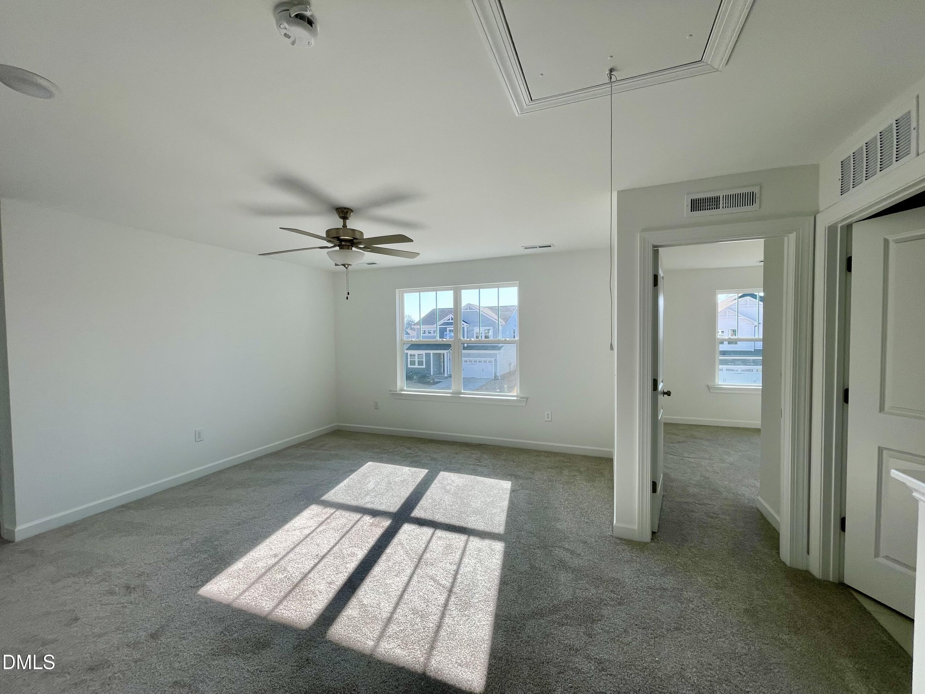 229 Sprenger Street Garner, NC 27529 - Photo 12 of 37 an empty room with windows and closet