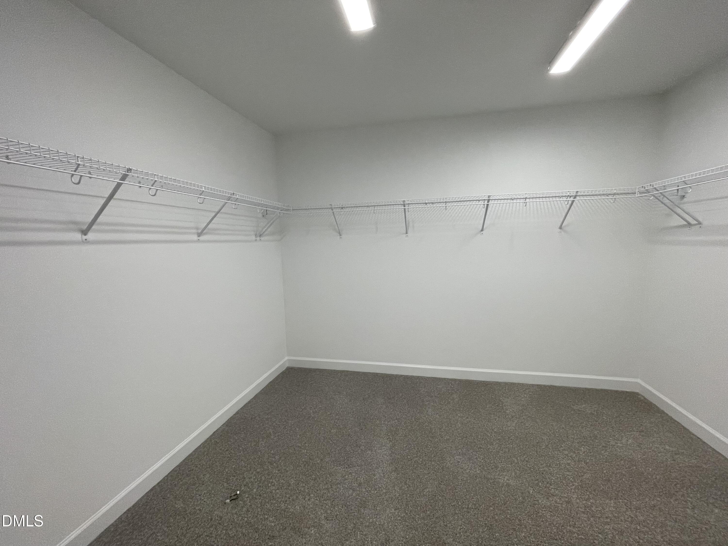 229 Sprenger Street Garner, NC 27529 - Photo 17 of 37 a view of a room with racks on the wall