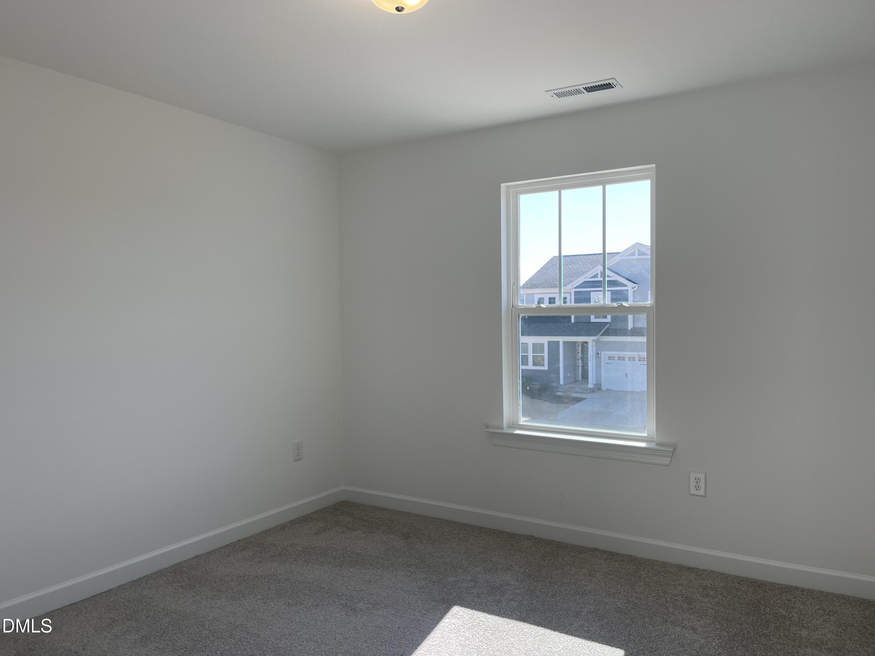 229 Sprenger Street Garner, NC 27529 - Photo 21 of 37 an empty room with a window