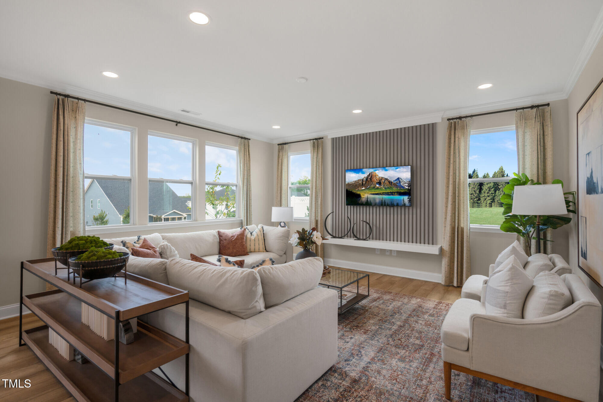 229 Sprenger Street Garner, NC 27529 - Photo 29 of 37 a living room with furniture and a flat screen tv