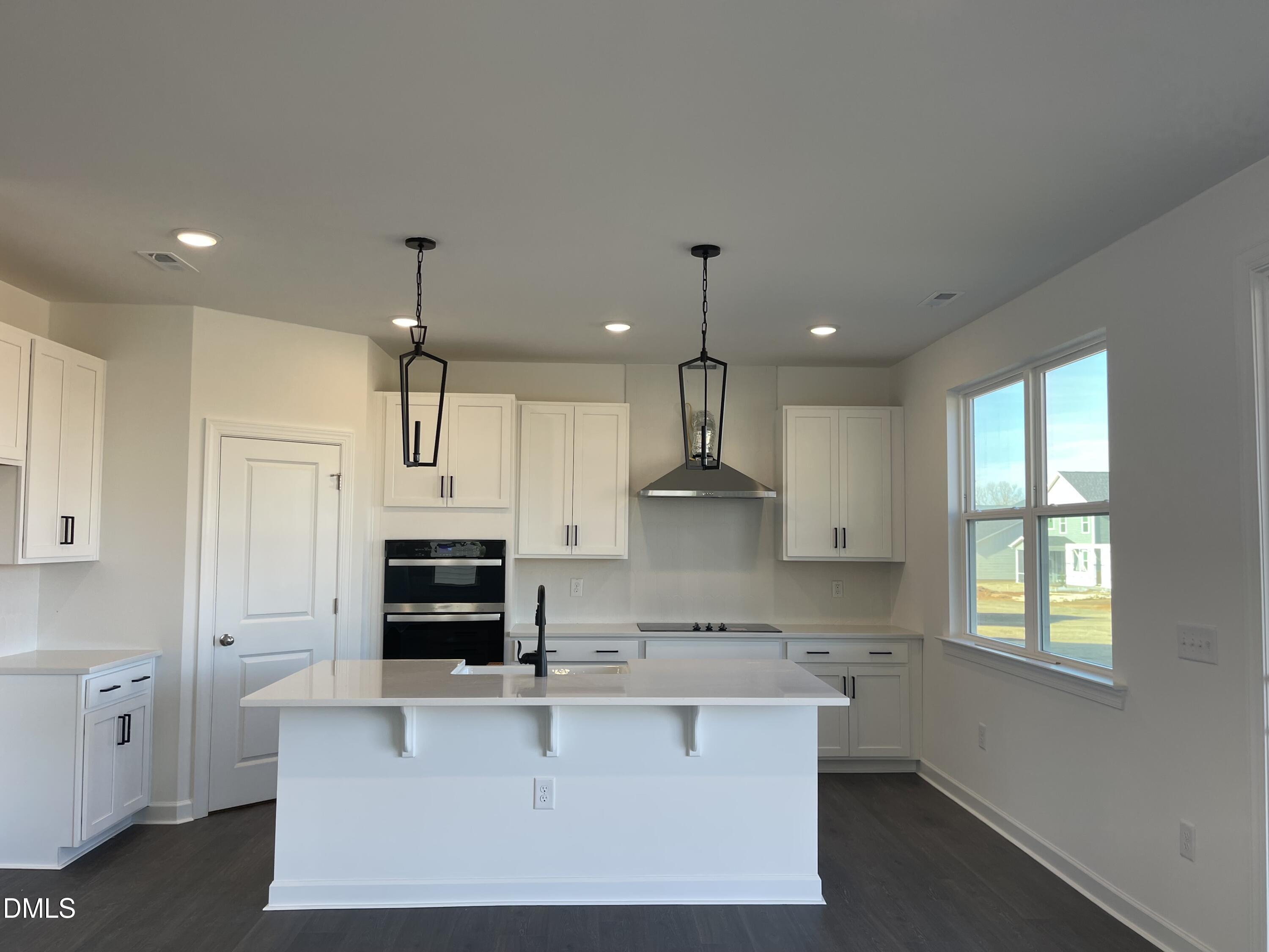 229 Sprenger Street Garner, NC 27529 - Photo 4 of 37 a large kitchen with cabinets