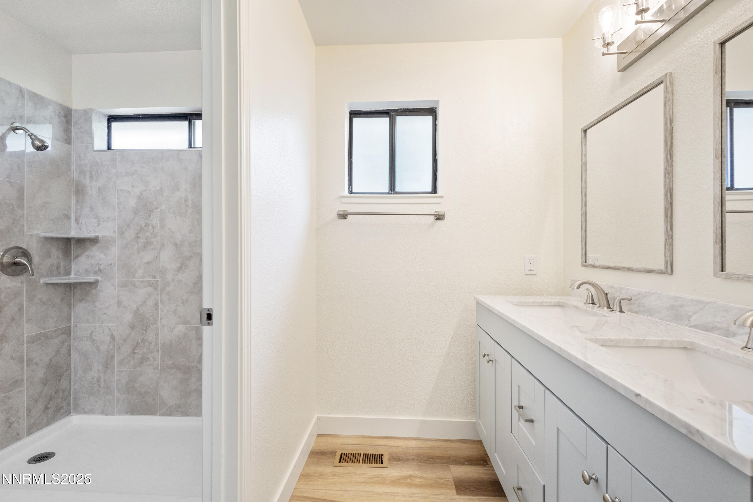 5809 Sydney Court Reno, NV 89523 - Photo 13 of 28 a bathroom with a sink and a mirror