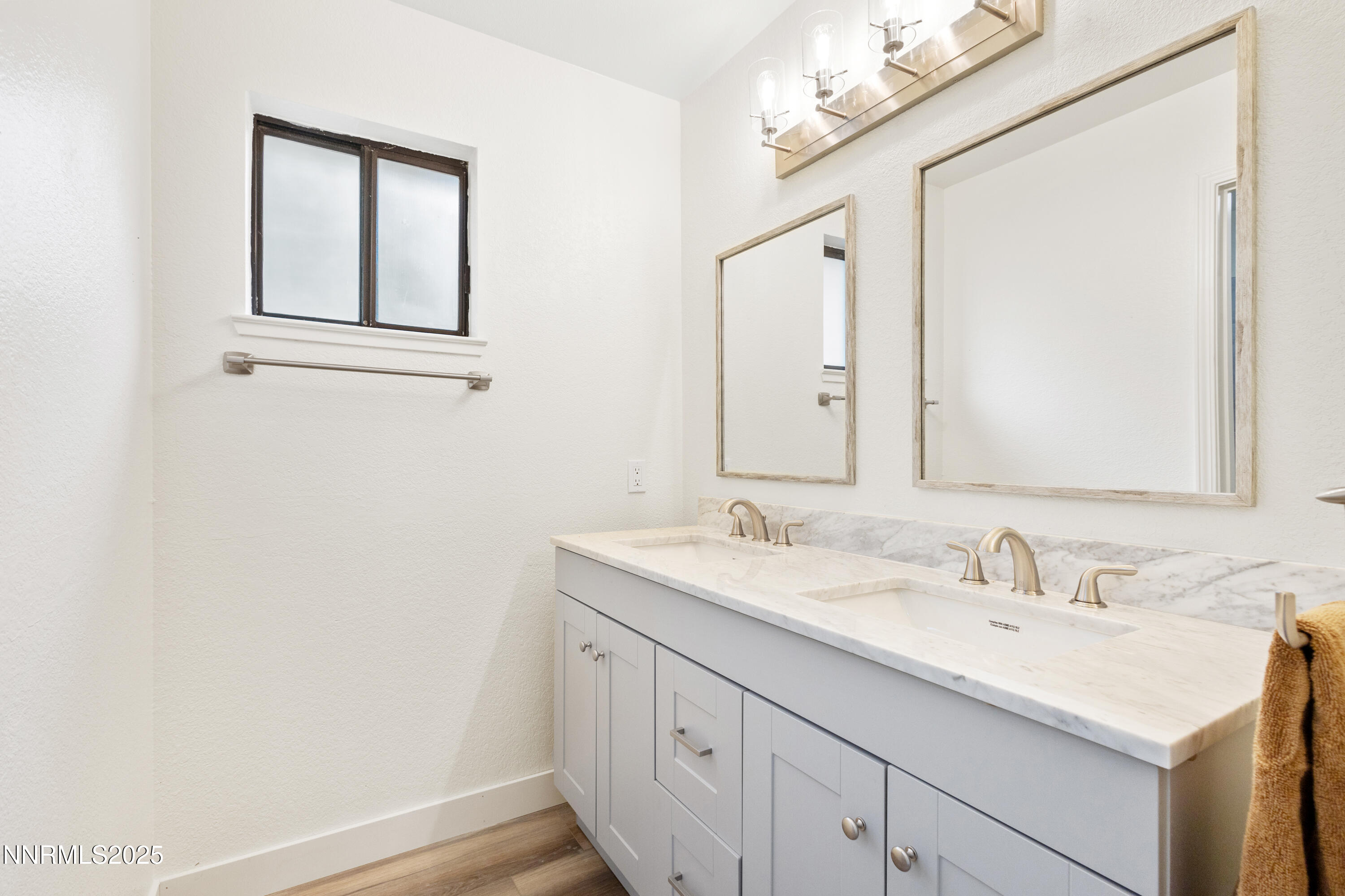 5809 Sydney Court Reno, NV 89523 - Photo 14 of 28 a bathroom with a sink a vanity and a mirror