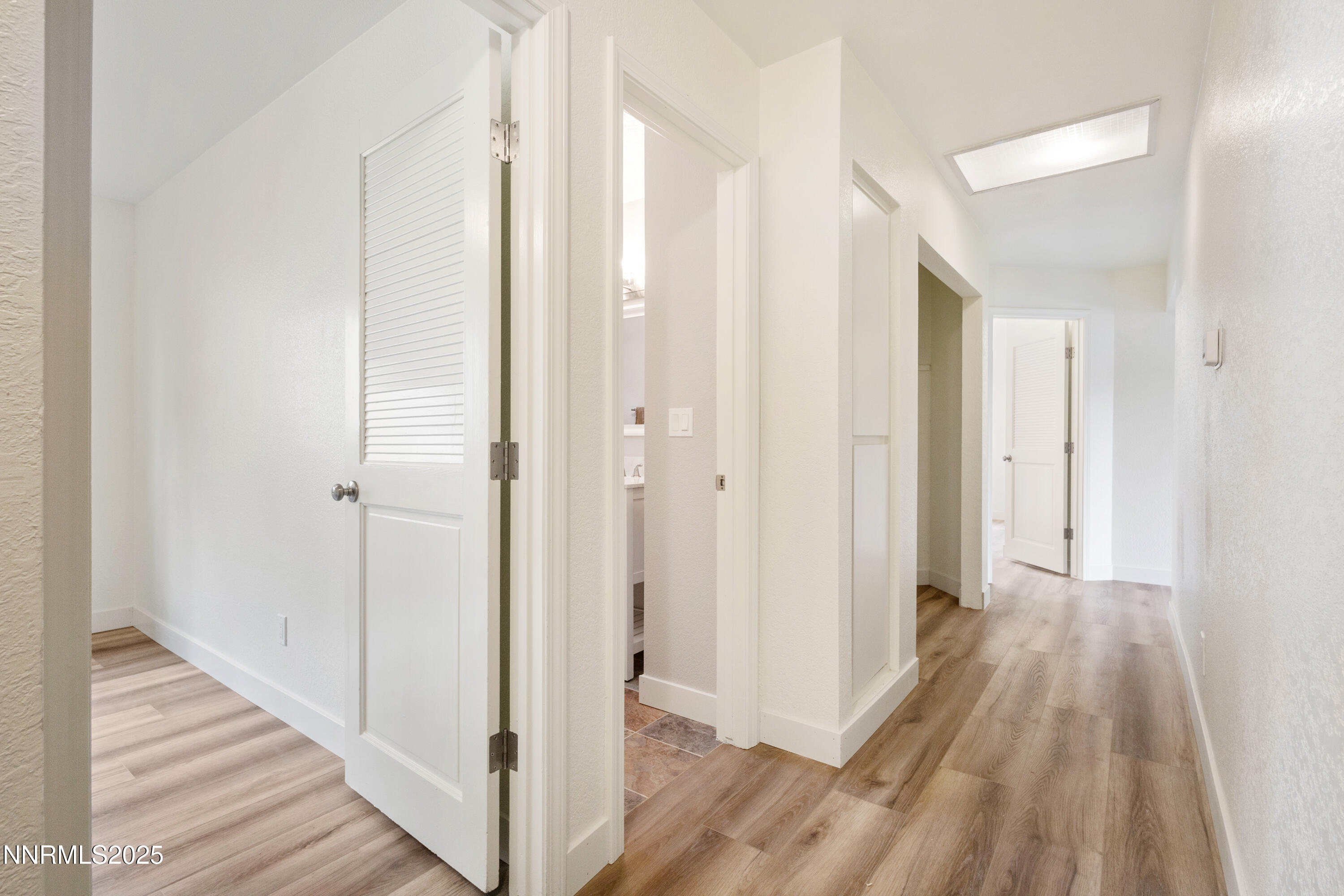 5809 Sydney Court Reno, NV 89523 - Photo 17 of 28 a view of a hallway with wooden floor and staircase