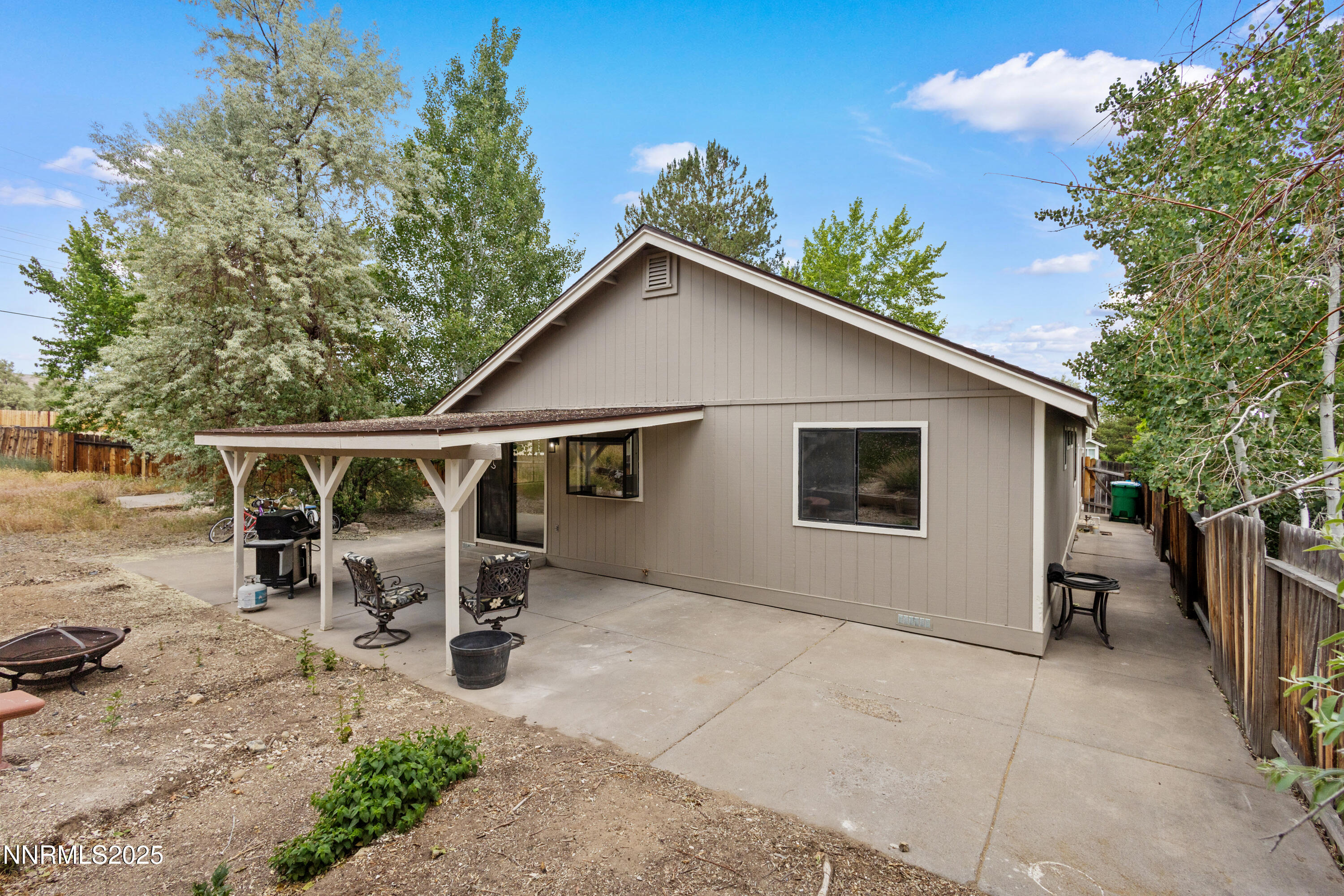 5809 Sydney Court Reno, NV 89523 - Photo 23 of 28 a backyard of a house with table and chairs
