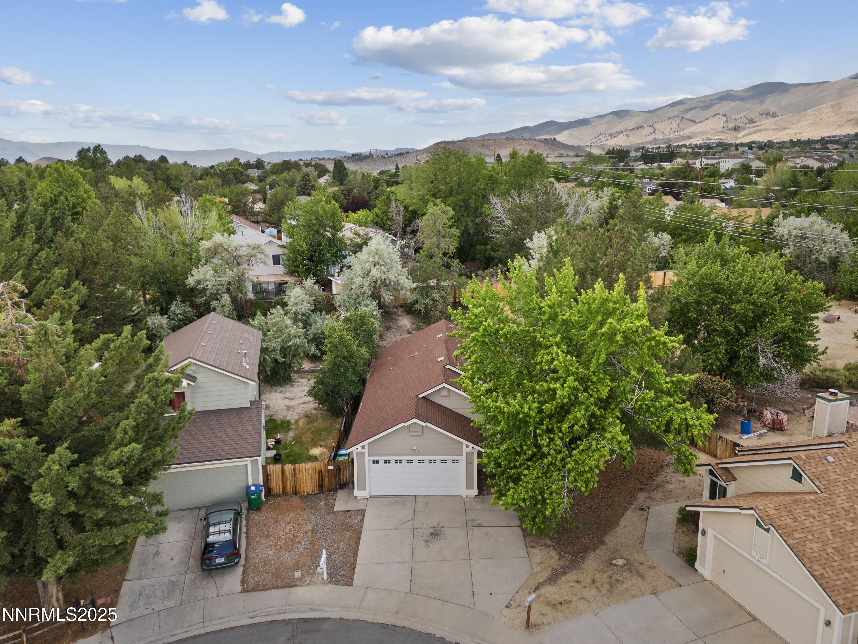 5809 Sydney Court Reno, NV 89523 - Photo 25 of 28 an aerial view of a house with a yard and mountain view in back