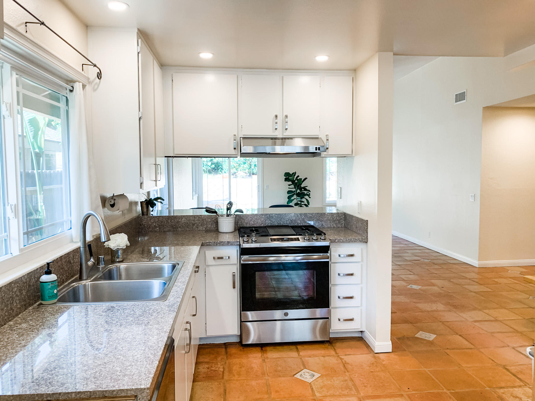 5785 Firebird Court Camarillo, CA 93012 - Photo 11 of 23 a kitchen with stainless steel appliances granite countertop a stove a sink and a refrigerator