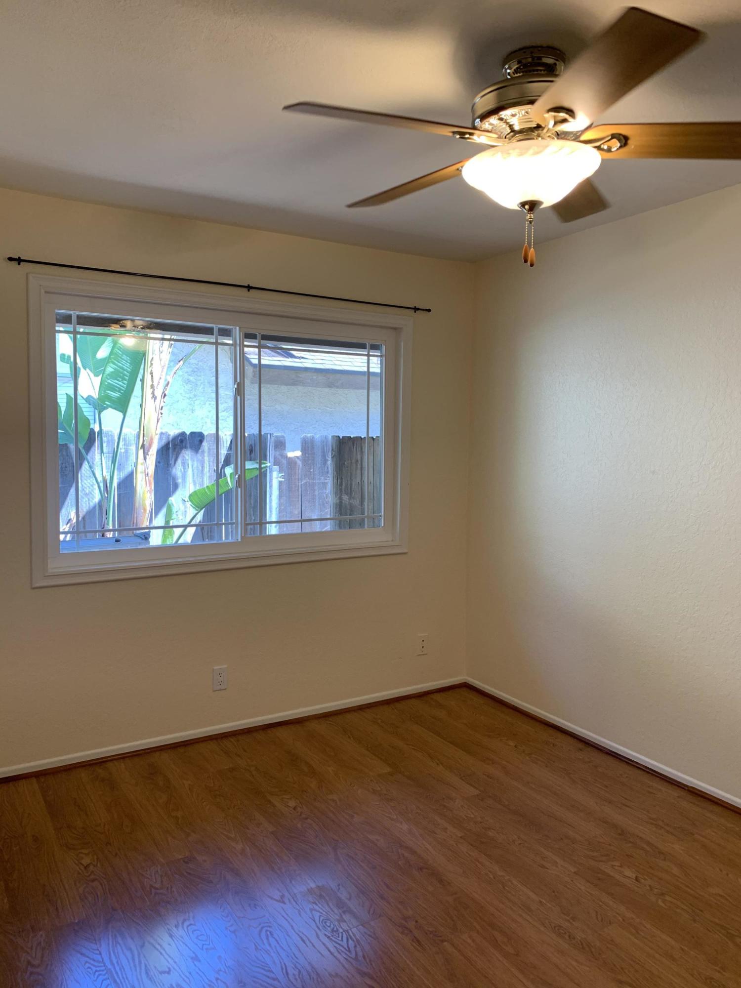 5785 Firebird Court Camarillo, CA 93012 - Photo 15 of 23 a view of empty room with wooden floor and fan