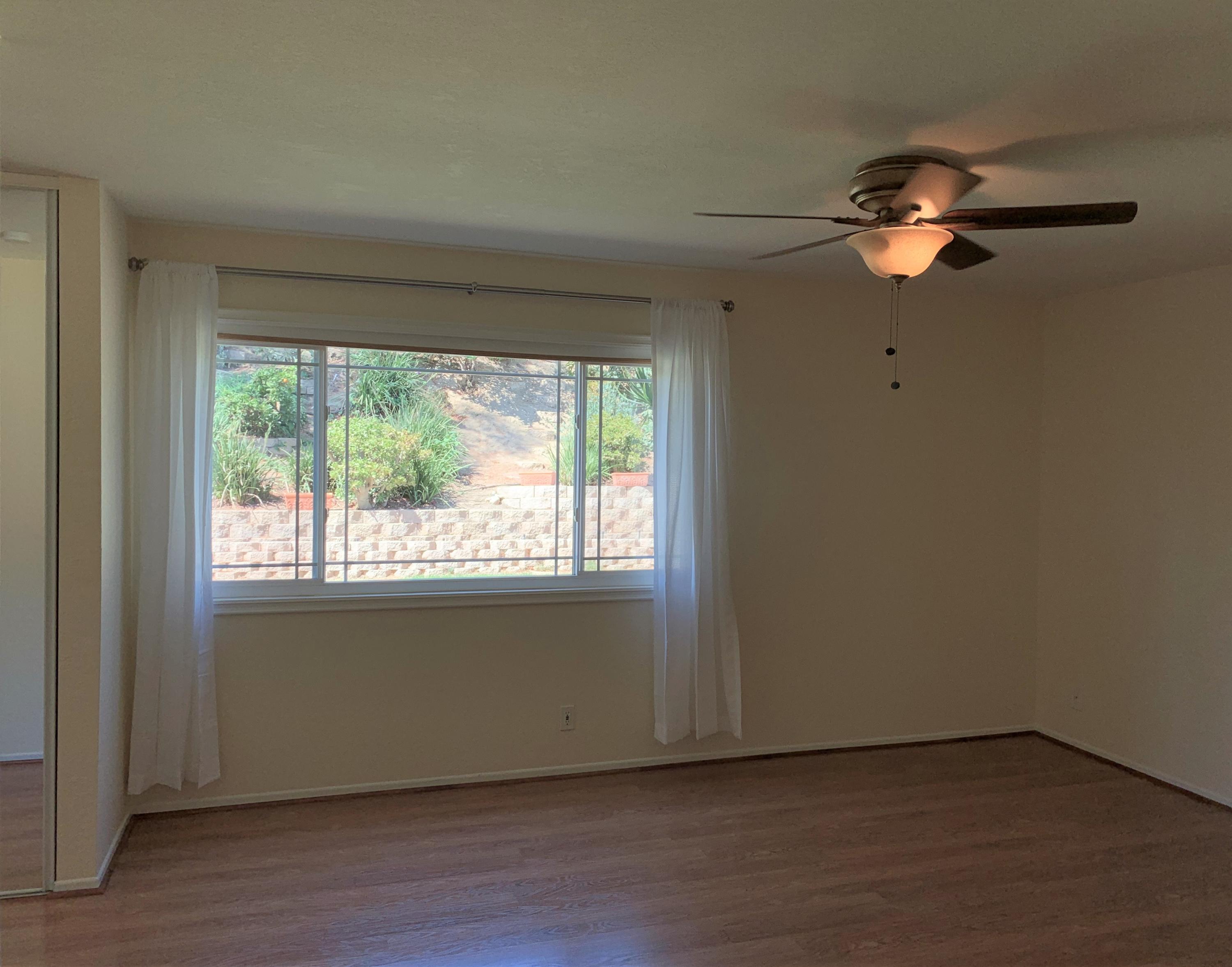 5785 Firebird Court Camarillo, CA 93012 - Photo 17 of 23 a view of empty room with wooden floor and fan