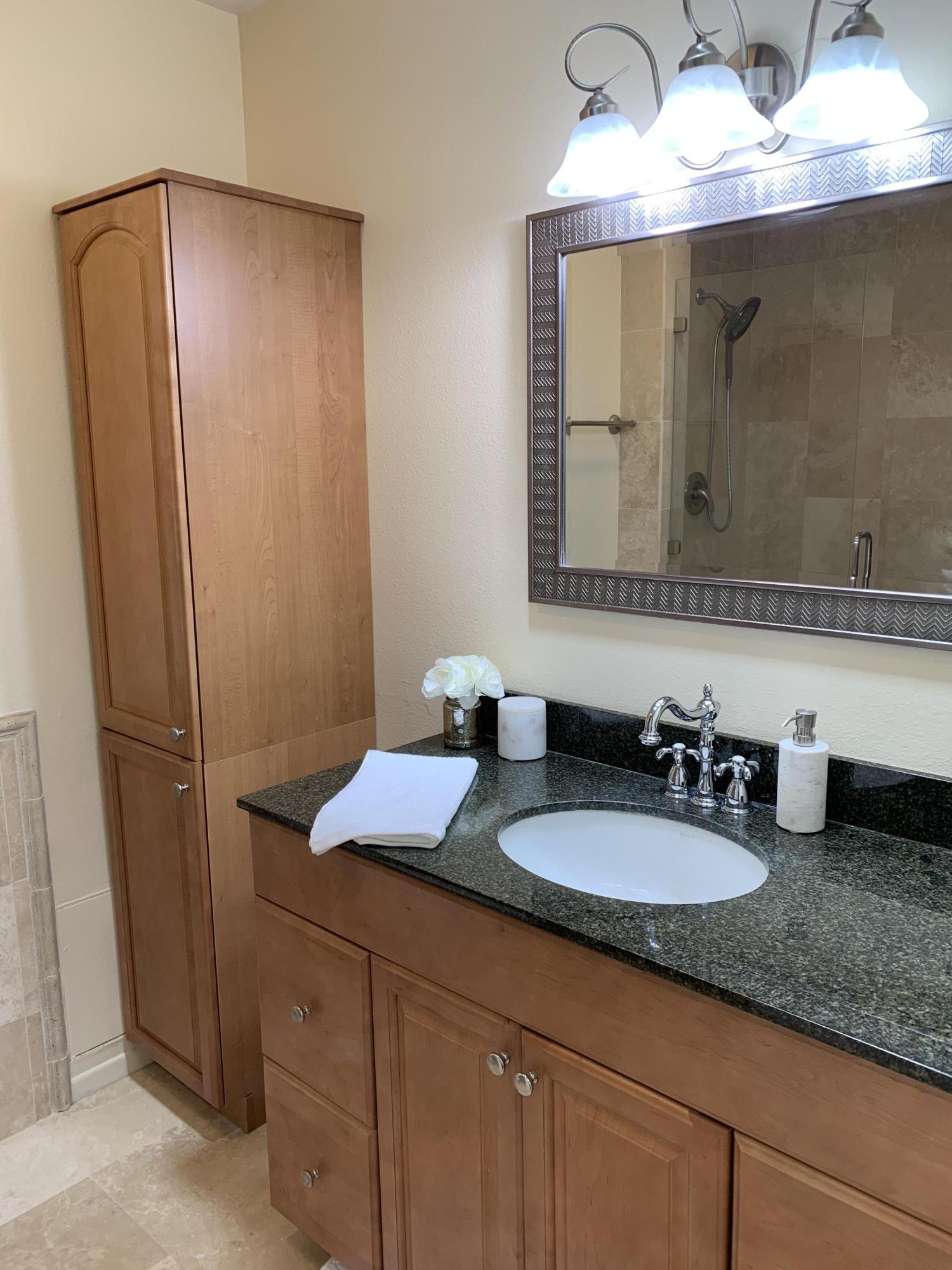 5785 Firebird Court Camarillo, CA 93012 - Photo 18 of 23 a bathroom with a granite countertop sink and a mirror