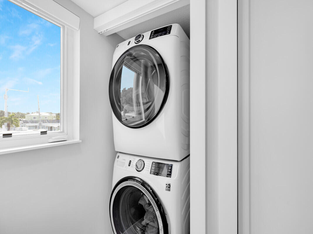 325 Calusa Street, Unit 359 Key Largo, FL 33037 - Photo 26 of 52 a utility room with dryer and washer