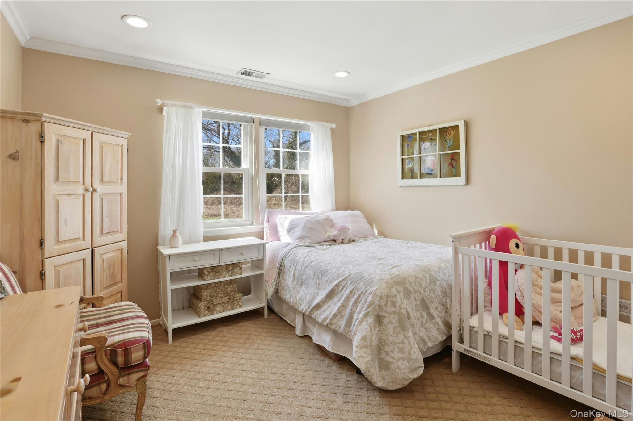 78 Hidden Ridge Drive Syosset, NY 11791 - Photo 15 of 21 a bedroom with a bed and a window