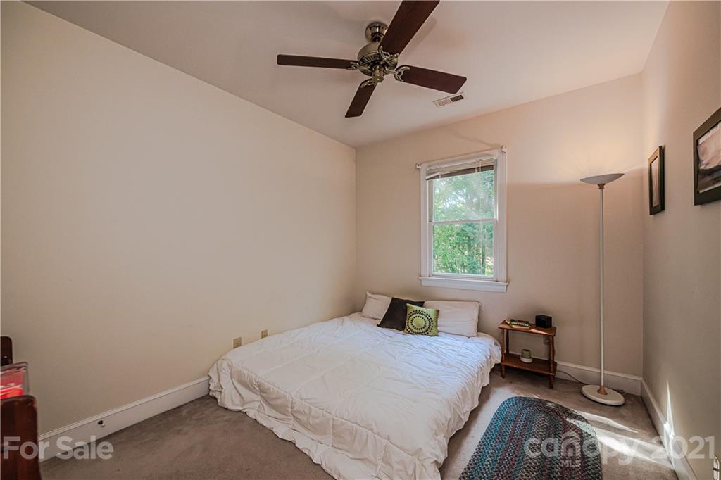 154 Morrison Hill Road Davidson, NC 28036 - Photo 14 of 23 a bedroom with a bed and a window