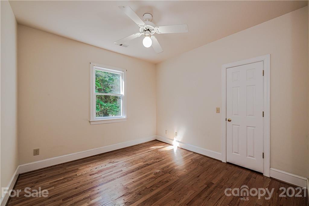 154 Morrison Hill Road Davidson, NC 28036 - Photo 15 of 23 a view of an empty room with wooden floor and a window