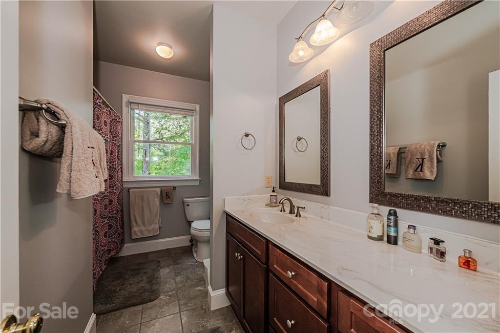 154 Morrison Hill Road Davidson, NC 28036 - Photo 16 of 23 a bathroom with a sink double vanity and a mirror