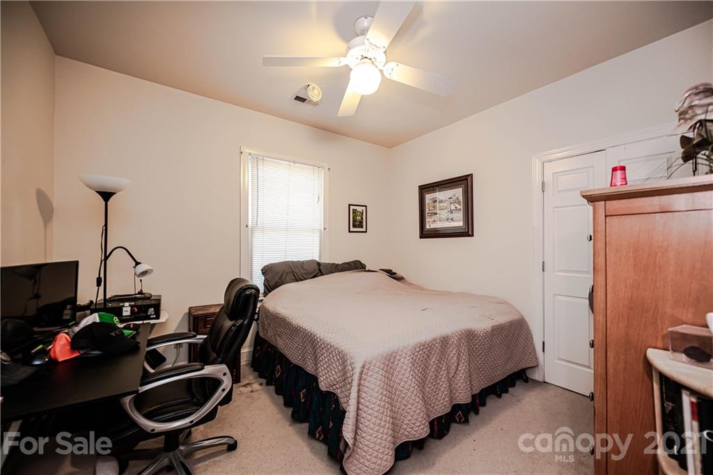154 Morrison Hill Road Davidson, NC 28036 - Photo 17 of 23 a bedroom with a bed and a desk