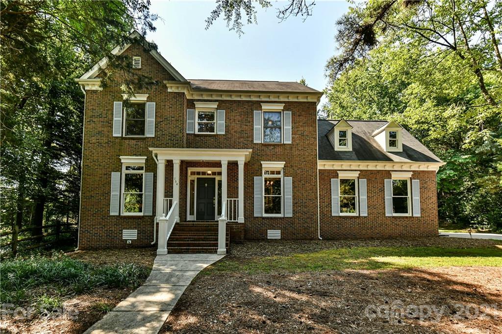 154 Morrison Hill Road Davidson, NC 28036 - Photo 23 of 23 a front view of a house with garden