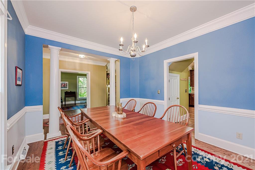 154 Morrison Hill Road Davidson, NC 28036 - Photo 4 of 23 a view of a dining room with furniture and chandelier
