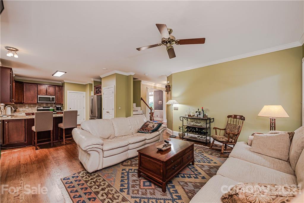 154 Morrison Hill Road Davidson, NC 28036 - Photo 7 of 23 a living room with furniture and a wooden floor