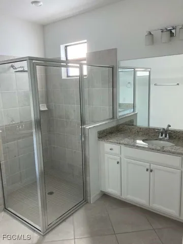 a view of a lake with houses in the background