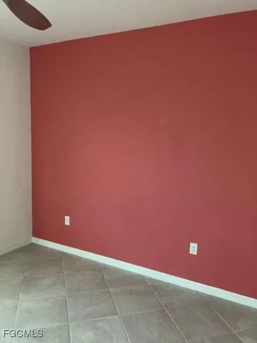 a bathroom with a granite countertop shower mirror and a sink