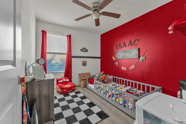 a bedroom with furniture and a chandelier
