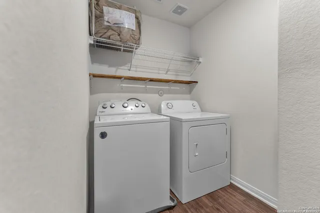 a utility room with dryer and washer