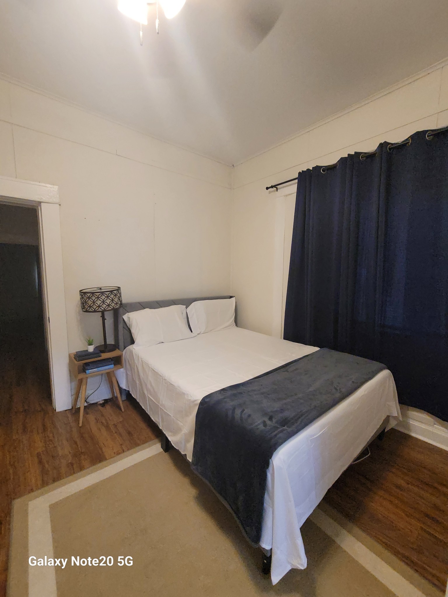 426 West King Street Jackson, TN 38301 - Photo 13 of 17 a bedroom with a bed and wooden floor