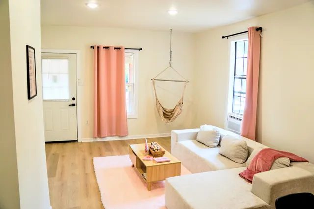 a living room with furniture and a window