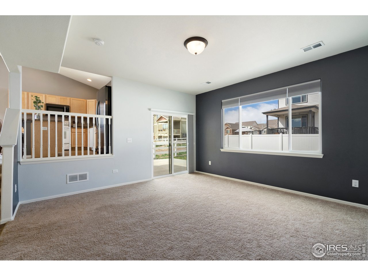 8705 13th St Road Greeley, CO 80634 - Photo 19 of 40 Lower level family room with glass sliding door access to the back patio.