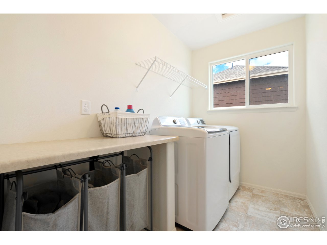 8705 13th St Road Greeley, CO 80634 - Photo 24 of 40 Upstairs laundry room conveniently located near the bedrooms.