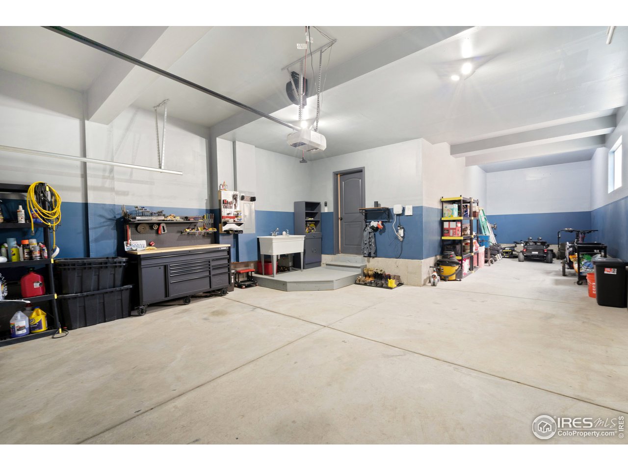 8705 13th St Road Greeley, CO 80634 - Photo 30 of 40 Fully finished 3-car tandem garage with shop sink and LED lighting.