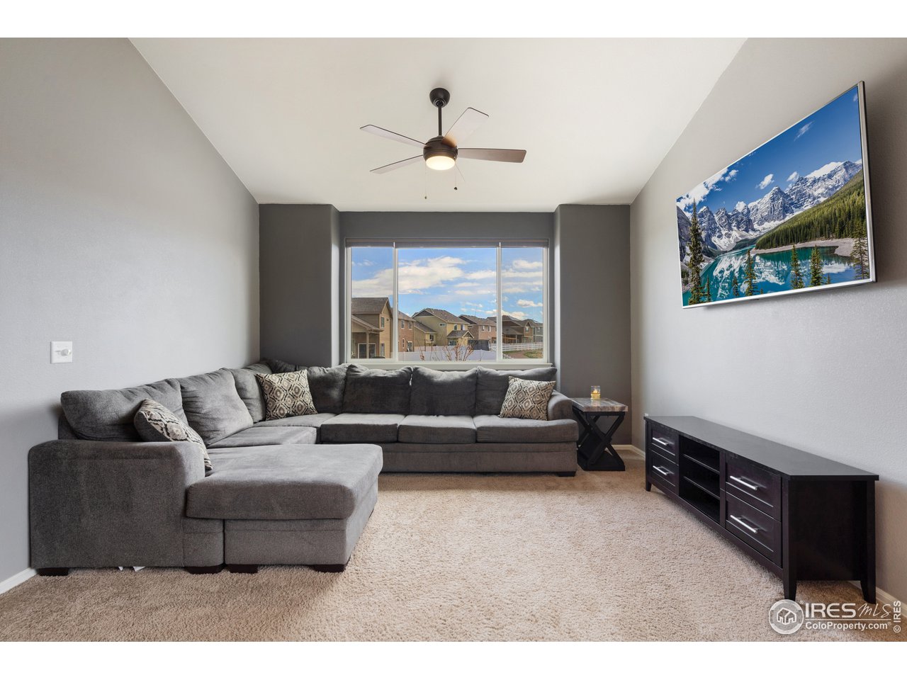 8705 13th St Road Greeley, CO 80634 - Photo 6 of 40 Living room with view from picture window and lots of natural light.