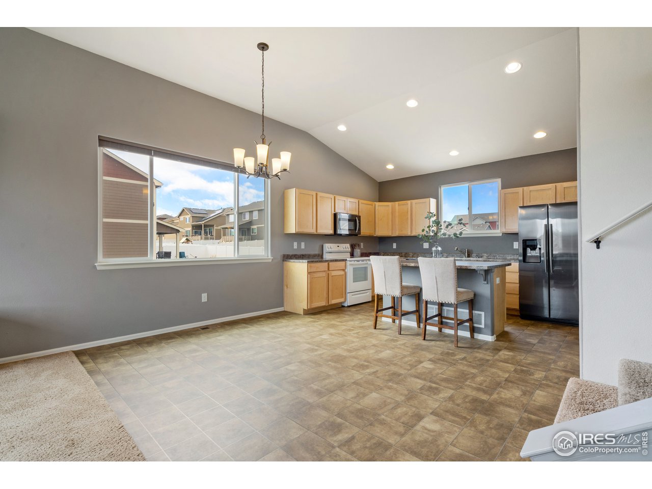 8705 13th St Road Greeley, CO 80634 - Photo 10 of 40 Big open feel to the blended main floor great for entertaining.