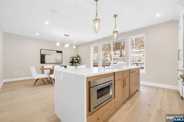 a kitchen with a stove a sink and a refrigerator